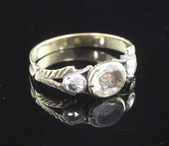 An 18th century gold, Stuart Crystal and diamond set mourning skull ring, size J approx.